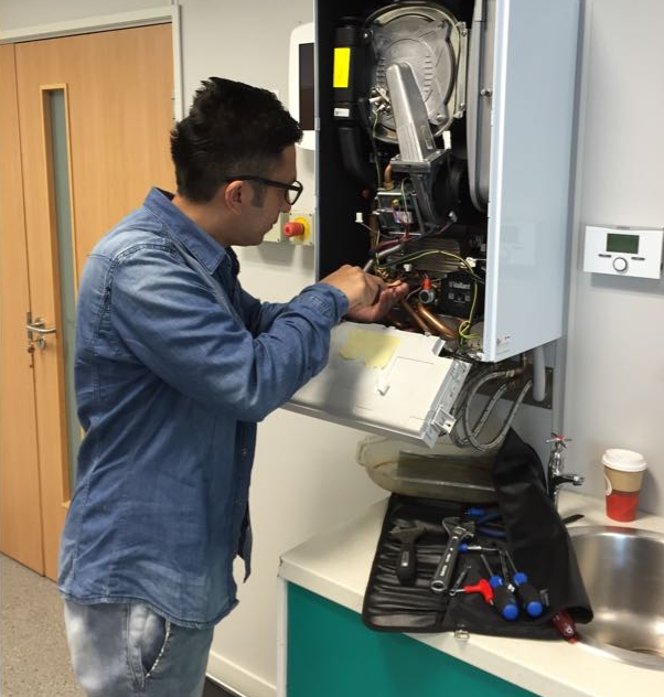 Heating engineer at work